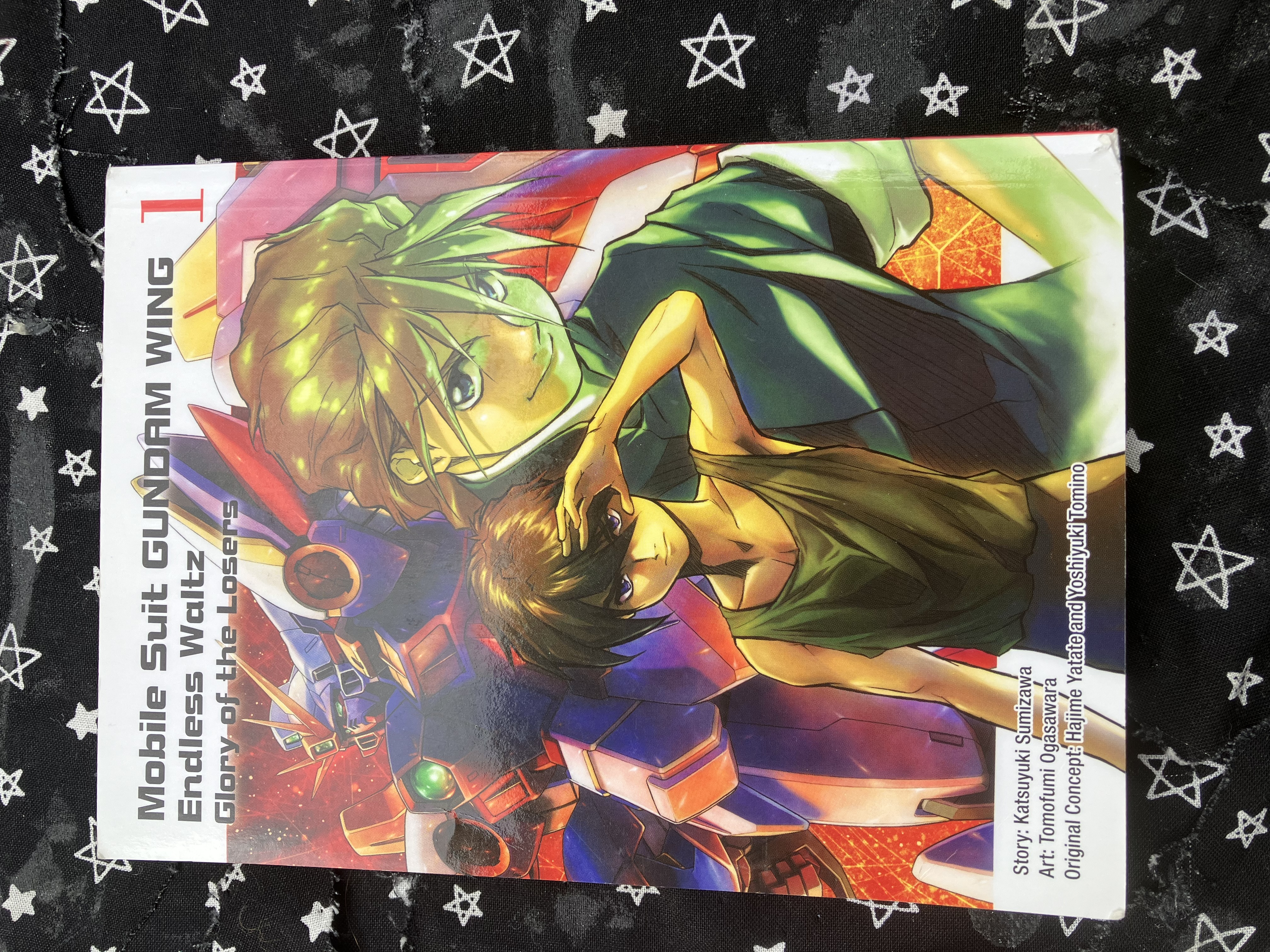 Front of volume 1 of the manga Mobile Suit Gundam Wing: Endless Waltz: Glory of the Losers with Heero, Duo, and Wing on the cover.